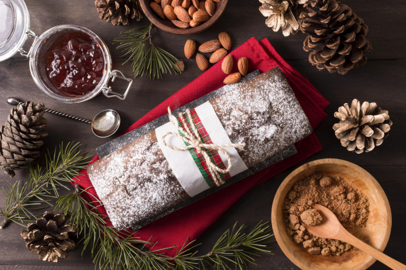 flat-lay-christmas-cake-with-almonds-pine-cones-550